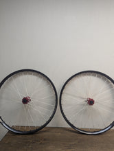 Load image into Gallery viewer, We Are One Triad 27.5 Inch Rims With Industry Nine Hydra Red Hubs White Berd Spokes Sale