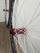 Load image into Gallery viewer, We Are One Triad 27.5 Inch Rims With Industry Nine Hydra Red Hubs White Berd Spokes Sale